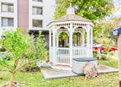 Thumbnail 15 of 17 - gazebo surrounded by lush green landscaping