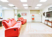 Thumbnail 3 of 17 - large sitting area with reclining couches and TV and popcorn machine