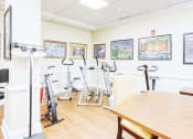 Thumbnail 6 of 17 - Exercise fitness center with cardio equipment and doctor's scale