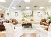 Thumbnail 4 of 17 - comfortable lobby with couches and chairs and lots of art