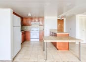 Thumbnail 14 of 24 - kitchen with efficient appliance package, ample cabinetry, and island