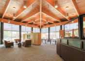 Thumbnail 7 of 24 - lobby with high ceiling, ceiling to floor windows, and seating