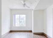 Thumbnail 7 of 12 - Bedroom with large window and ceiling fan