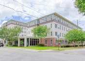 Thumbnail 1 of 12 - Neatly landscaped exterior of St. Giles Manor II Senior Apartments