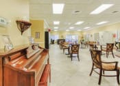 Thumbnail 11 of 15 - Piano in community room with ample seating