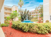 Thumbnail 7 of 23 - Courtyard with neat mulching, landscaping and fountain