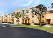 Thumbnail 10 of 24 - lush landscaping and well-kept sidewalks at Crystal Lake Apartments