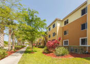 Thumbnail 6 of 13 - neatly manicured landscaping at our income-restricted apartments