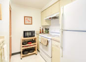 Thumbnail 18 of 23 - kitchen with cabinetry and white appliances