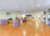 Thumbnail 9 of 23 - large open seating area beside elevator banks