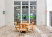 Thumbnail 9 of 16 - table and chairs on outside patio beside large window