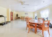 Thumbnail 8 of 16 - community room with tables, chairs, and exercise equipment