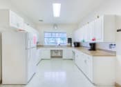 Thumbnail 7 of 16 - community kitchen with lots of cabinet and counter space