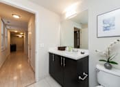 Thumbnail 10 of 12 - Renovated Bathrooms With Quartz Counters at The Woodward Building Apartments, Washington, DC 20005