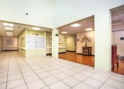 Thumbnail 2 of 12 - lobby of Villa Vincente with tile & wood-style floor and mailbox bank in wall