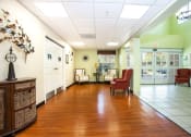 Thumbnail 3 of 12 - lobby of Villa Vincente with tile & wood-style floor and mailbox bank in wall