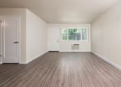 Thumbnail 8 of 17 - View of living area with well lit entry at front entry
