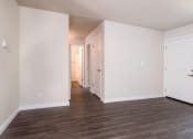 Thumbnail 9 of 17 - View down hallway from living area, with wood look flooring