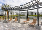 Thumbnail 15 of 44 - Coralina Apartments | Cape Coral, FL | Island-Style Lagoon Pool