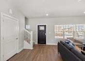 Thumbnail 6 of 54 - Living room at the Quarry Apartments in DeWitt Michigan
