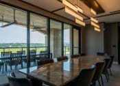 Thumbnail 68 of 75 - large conference room with large conference table and chairs looking over a patio at The Apex at CityPlace, Overland Park, KS