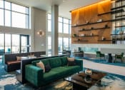 Thumbnail 71 of 75 - large atrium with long couches placed around coffee tables and large windows at The Apex at CityPlace, Overland Park, 66210