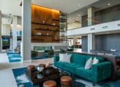 Thumbnail 72 of 75 - atrium with long teal couches and brown coffee tables at The Apex at CityPlace, Kansas