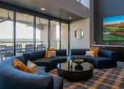 Thumbnail 75 of 75 - half circle couch around circular black table in a room with big windows and a counter at The Apex at CityPlace, Overland Park, KS