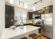 Thumbnail 52 of 78 - Granite Countertops In Kitchen at Pointe at Prosperity Village Apartment Homes in Charlotte