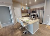 Thumbnail 26 of 92 - Island Kitchen at Upscale Living at the Grand off 45th, North Dakota