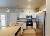 Thumbnail 13 of 92 - Granite Countertop Kitchen at Upscale Living at the Grand off 45th, North Dakota