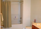 Thumbnail 11 of 12 - Large bathroom with shower and tub at Prairie Apartments