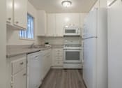 Thumbnail 4 of 8 - Kitchen with new flooring counters and appliances