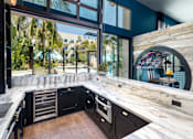 Thumbnail 14 of 53 - Clubroom with bar and lounge area at Vida North Park, San Diego