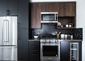Thumbnail 7 of 53 - Kitchen with stainless steel appliances at Vida North Park, California, 92104