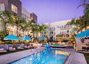 Thumbnail 39 of 53 - Outdoor lounge area, pool and hot tub at Vida North Park, San Diego, California