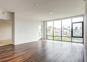 Thumbnail 45 of 53 - Living room with floor to ceiling windows at Vida North Park, San Diego