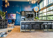 Thumbnail 48 of 53 - Clubroom with bar and lounge area at Vida North Park, San Diego, California