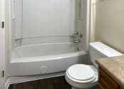 Thumbnail 14 of 18 - bathroom with tub and toilet