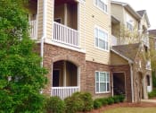 Thumbnail 4 of 13 - lush landscaping around apartment exterior