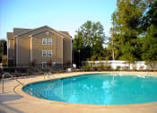 Thumbnail 6 of 13 - sparkling pool beside apartment building