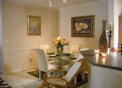Thumbnail 9 of 13 - model furnished dining room with track lighting