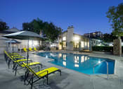Thumbnail 21 of 22 - the swimming pool at night at the apartments for rent