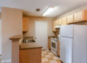 Thumbnail 12 of 23 - Model Kitchen at Bay Crossings Apartments, Mississippi, 39520