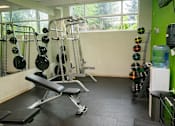 Thumbnail 11 of 16 - 24-Hour Fitness Center With Free Weights at Studio One Apartments, Detroit