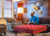 Thumbnail 24 of 38 - Residents enjoying the resident lounge