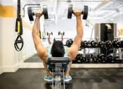Thumbnail 18 of 33 - Gym with free-weights in apartment building at Wilshire Vermont, Los Angeles, CA 90010