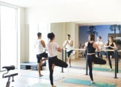 Thumbnail 19 of 33 - Yoga in gym at apartment building at Wilshire Vermont, Los Angeles, CA 90010