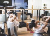 Thumbnail 20 of 33 - Gym with workout class at apartment in koreatown at Wilshire Vermont, Los Angeles, CA 90010