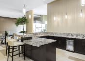 Thumbnail 22 of 33 - Lobby with large granite countertops at Wilshire Vermont, Los Angeles, CA